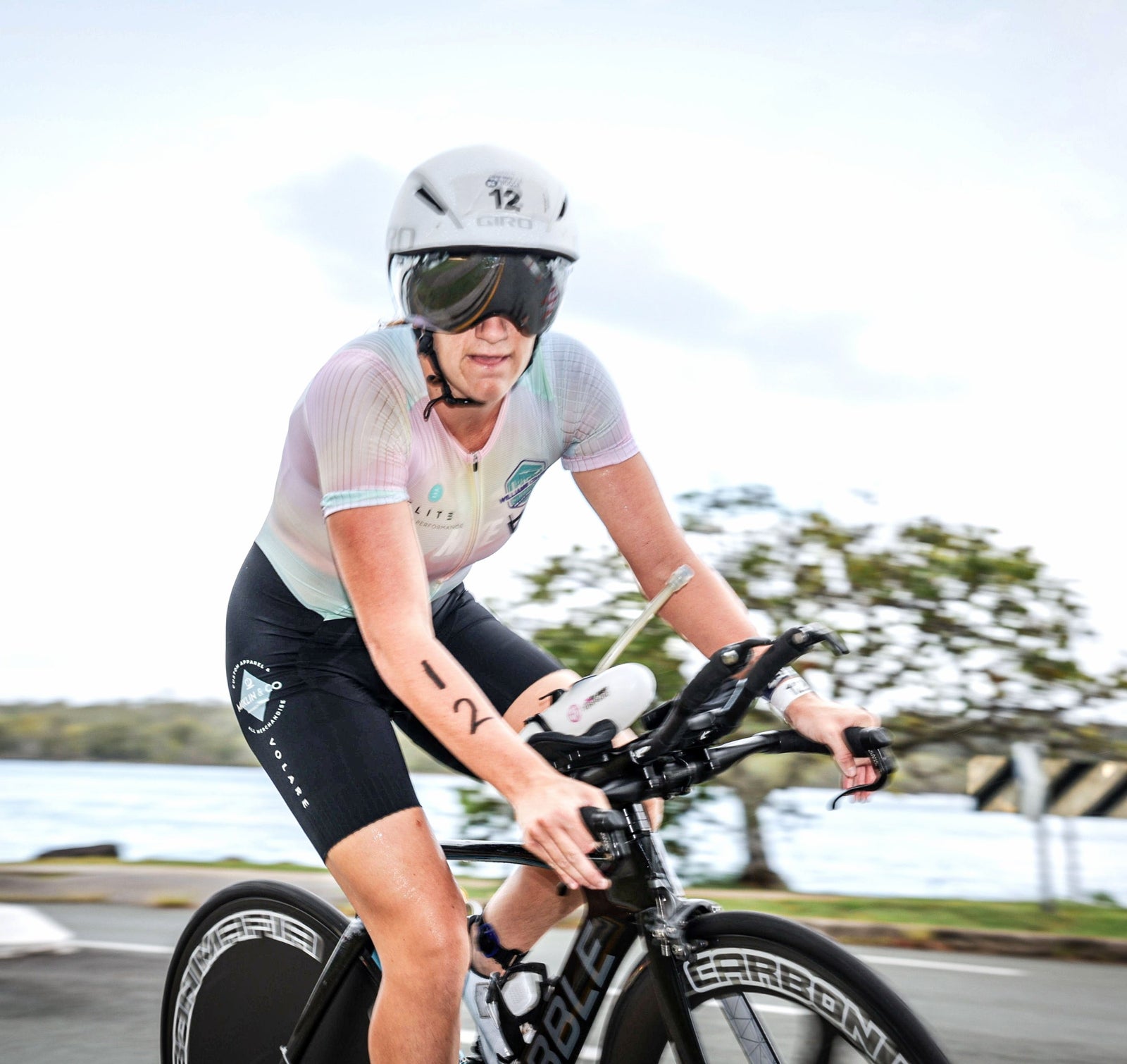 Mikayla Messer Displaying the Miklin and Co Logo on her Race Suit as she Races Noosa Triathlon