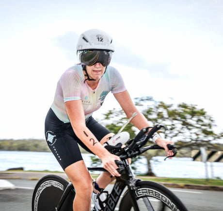 Mikayla Messer Displaying the Miklin and Co Logo on her Race Suit as she Races Noosa Triathlon
