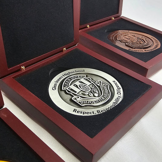 Glen Innes High School graduation medals with custom design and presentation box showing quality Australian-designed awards